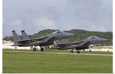 Two F-15 Eagles take off in formation from Kadena Air Base, Japan