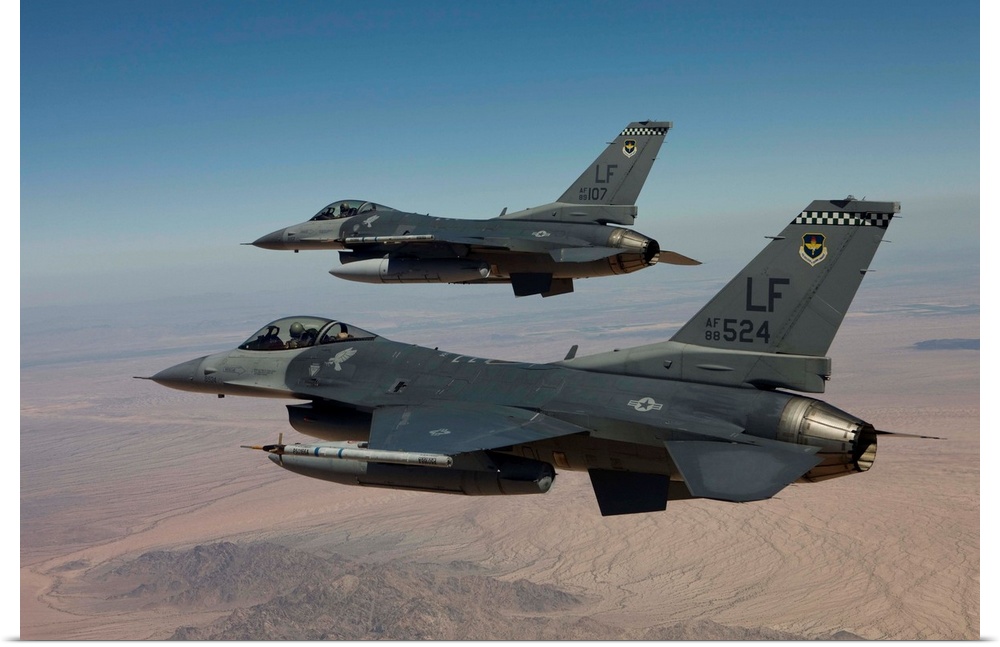 Two F-16's from the 56th Fighter Wing at Luke Air Force Base, Arizona, fly in formation over Arizona.