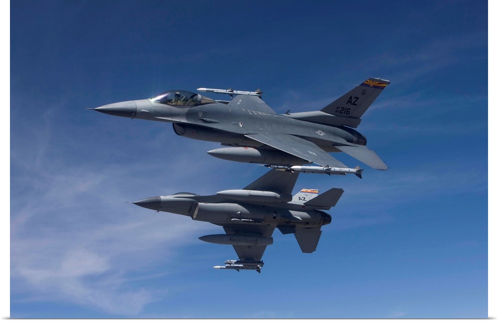 Two F-16's from the 162nd Fighter Wing manuever on an air-to-air training mission.