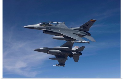 Two F-16s manuever on an air-to-air training mission