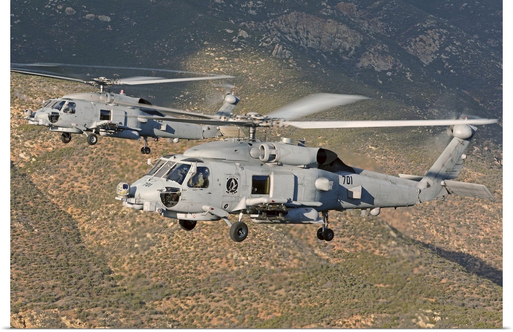 Two MH-60 helicopters of the U.S. Navy Blue Hawks squadron flying over Fallon, Nevada.