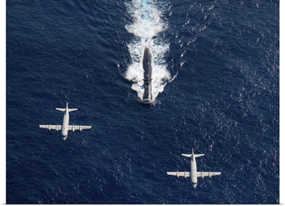 Two P 3 Orion maritime surveillance aircraft fly over attack submarine USS Houston