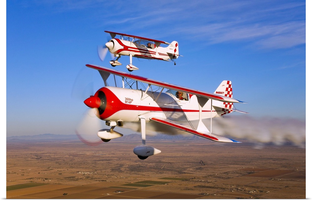 Two Pitts Model 12 aircraft in flight over Chandler, Arizona.