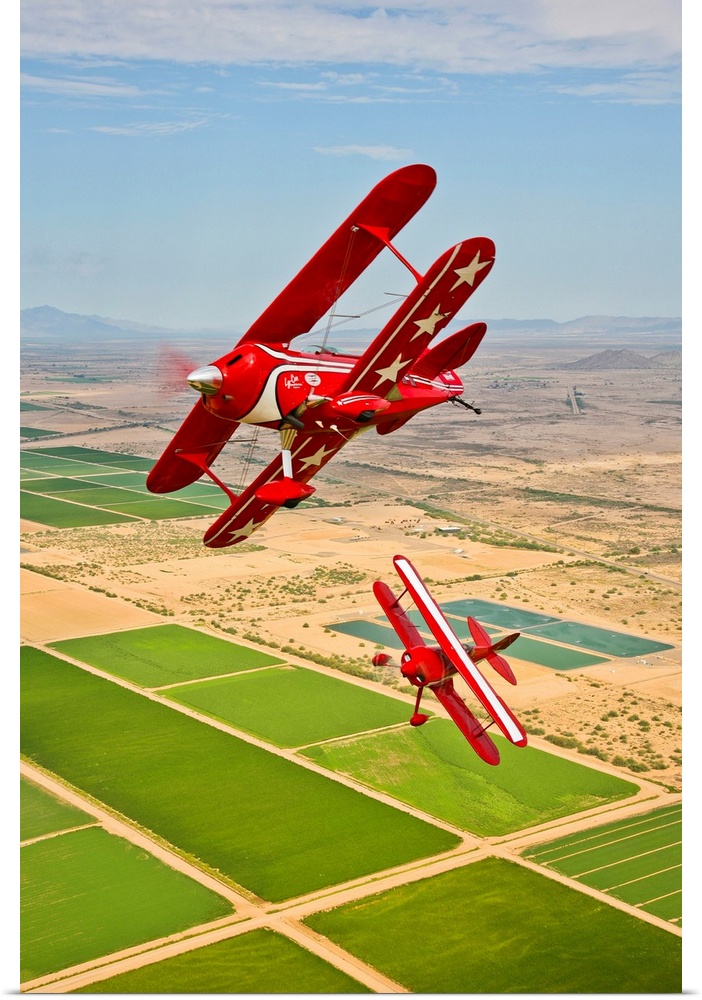 Two Pitts Special S-2A aerobatic biplanes in flight near Chandler, Arizona.