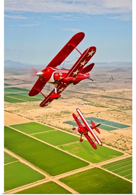 Two Pitts Special S-2A aerobatic biplanes in flight near Chandler, Arizona
