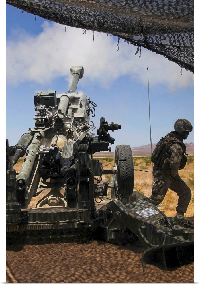 July 23, 2010 - U.S. Marines fire an M777 howitzer during the training exercise Enhanced Mojave Viper at Marine Corps Base...