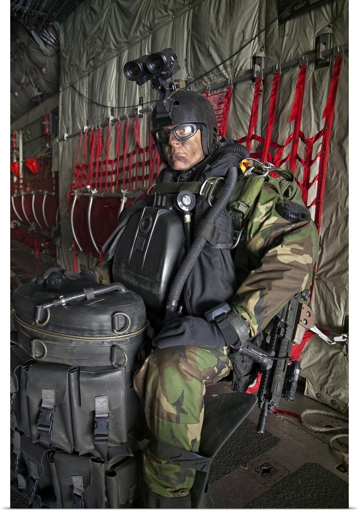 U.S. Navy Seal combat diver prepares for HALO jump operations from a C-130 Hercules.
