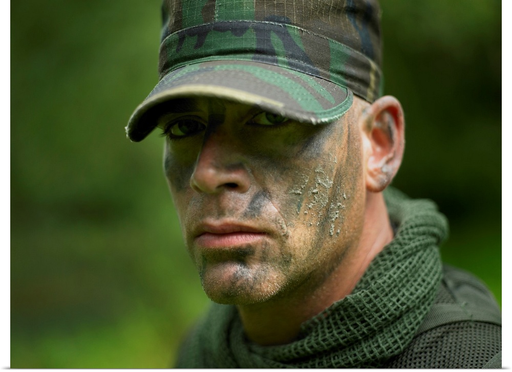 Close-up view of a U.S. Special Forces soldier with camouflage face paint.