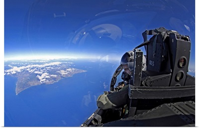 US Air Force captain looks out over the sky in a F15 Eagle