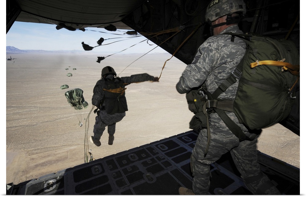 January 26, 2011 - U.S. Airmen jump from a C-130 Hercules aircraft over the Nevada Test and Training Range during Red Flag...