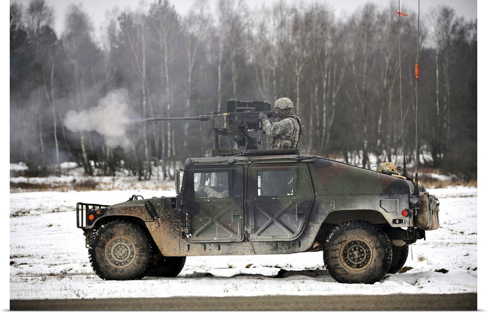 February 4, 2014 - U.S. Army paratrooper fires an M2 .50-caliber machine gun from a Humvee during a platoon-level, live-fi...