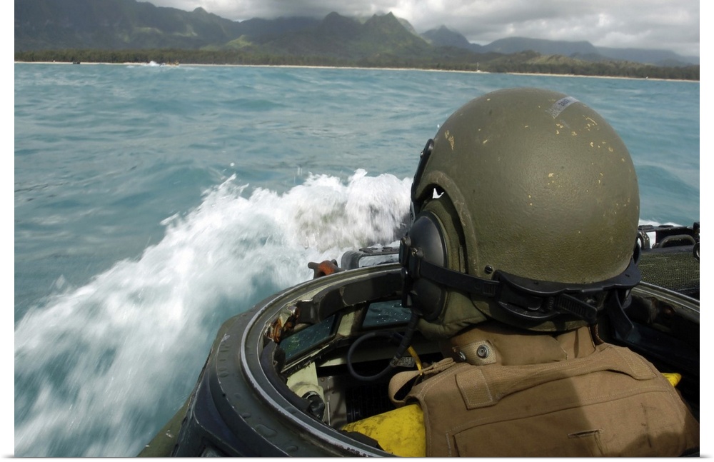 US Marine driving an amphibious assault vehicle through the Pacific Ocean