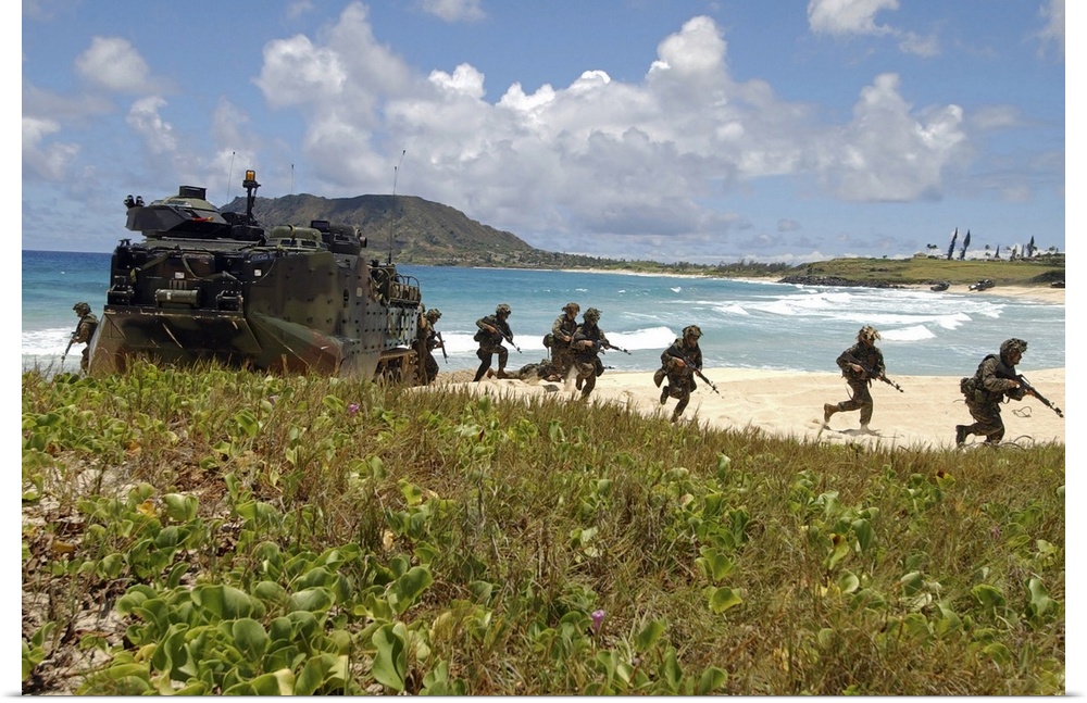 U.S. Marines run out of an Amphibious Assault Vehicle.