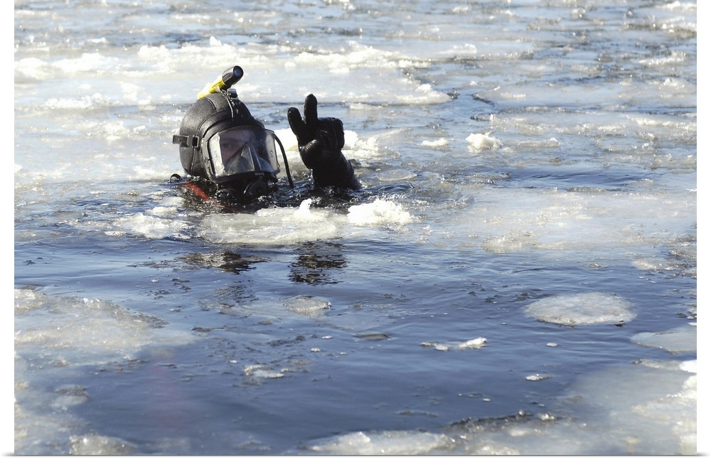 US Navy Diver signals he is okay during a training mission in the icy Thames River