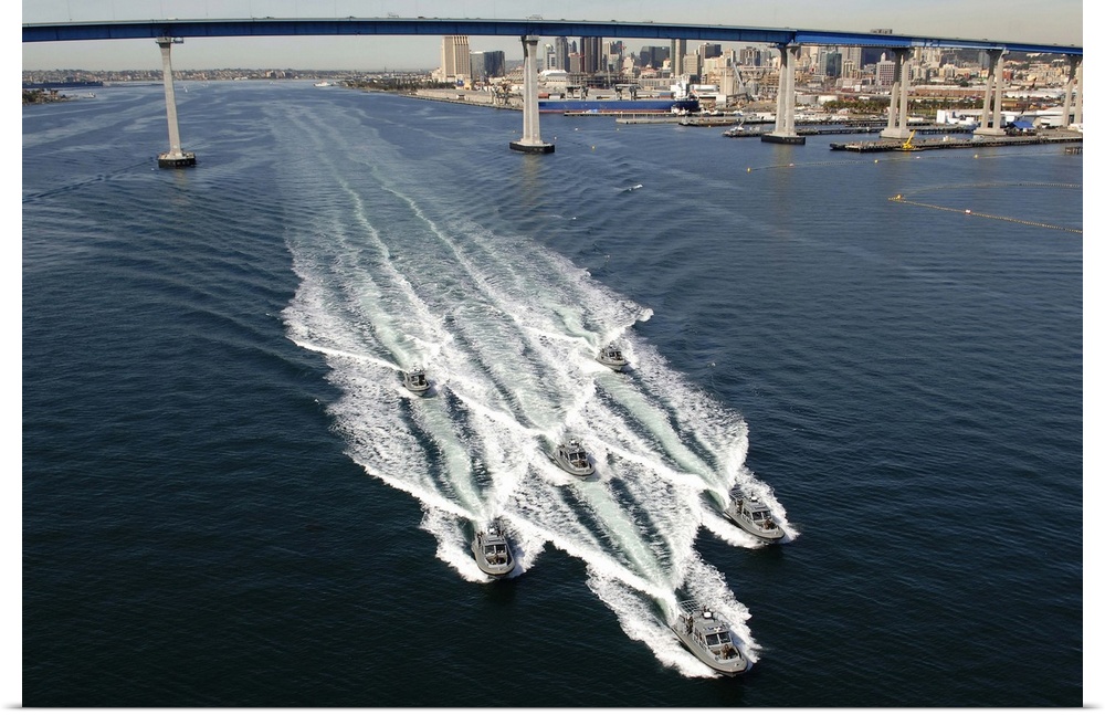 US Navy patrol boats conduct operations near the Coronado Bay Bridge in San Diego