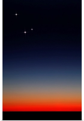 Venus, Mercury and Mars above the glowing horizon at dawn