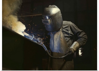 Welder making boilers for a ship at Combustion Engineering Co., Chattanooga, Tennessee.