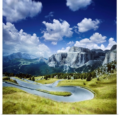 Winding road in a forest of Dolomite Alps, Northern Italy