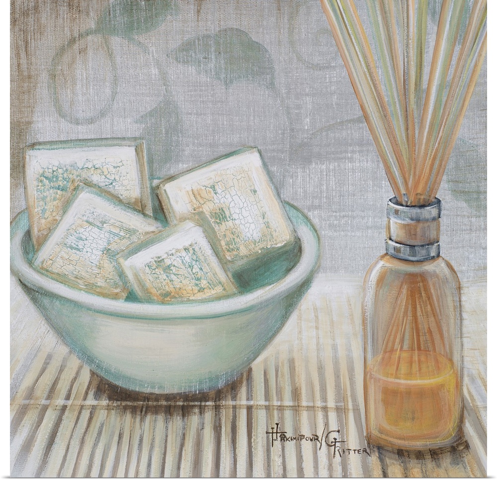Square, big canvas art of a bowl of square soaps sitting on a bamboo mat, next to that is a clear bottle reed diffuser, th...