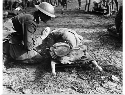 A British priest saying a prayer over a German soldier during World War I