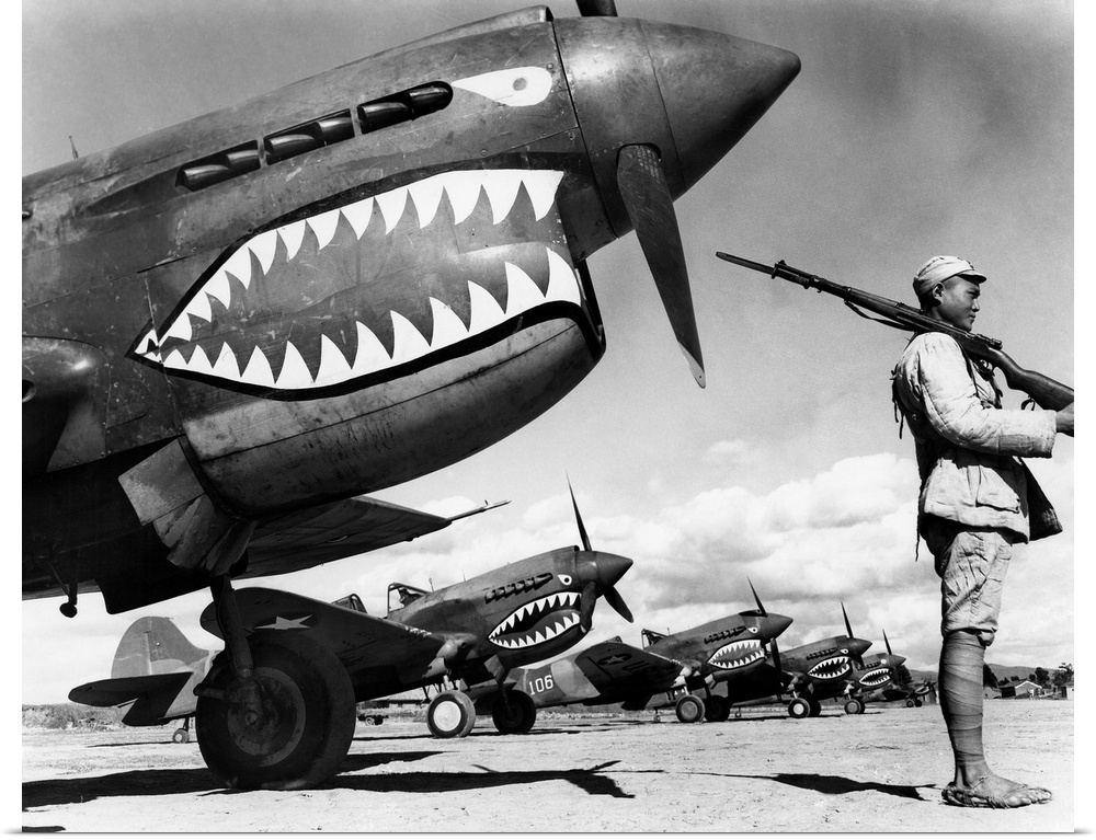 A Chinese soldier guards a squadron of Curtiss P-40 Warhawk fighter planes in China during World War II, 1943.