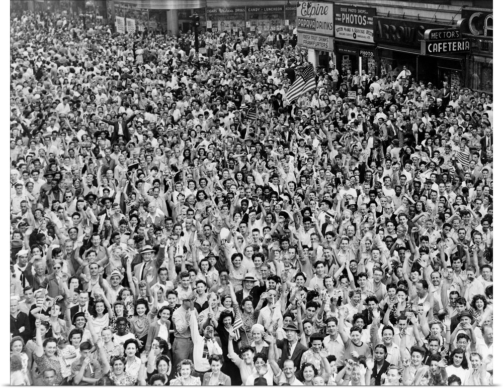 A crowd in Times Square celebrating the surrender of the Japanese at the end of World War II. Photograph by Dick DeMarsico...