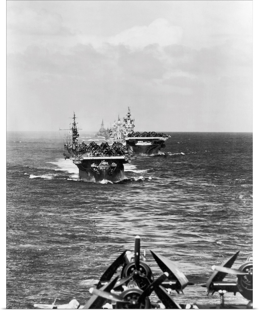 A fleet of aircraft carriers led by USS Langley make their way to the South Pacific, 12 December 1944.