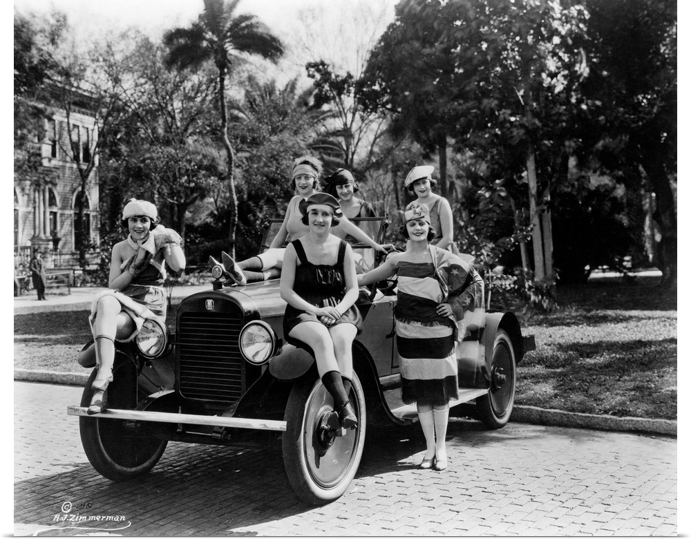 A group of Bathing Beauties posing with a Columbia Six Sport Automobile in Florida, c1920.