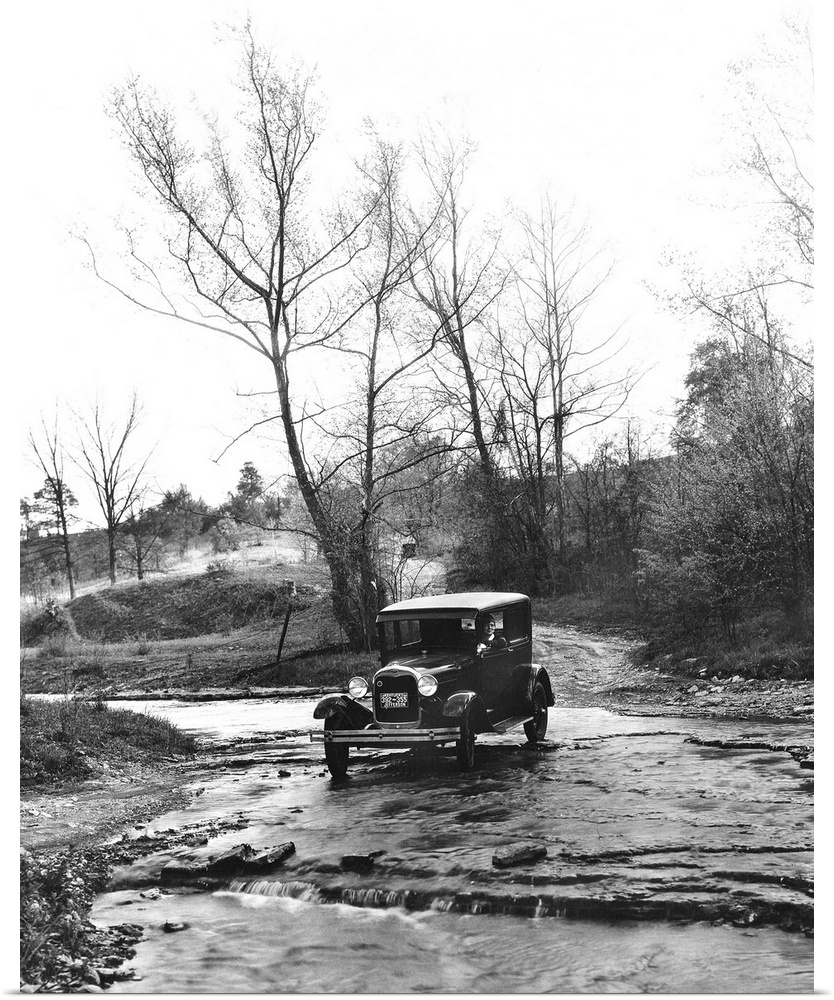 A Model A Ford crossing a creek bed in Oldham County, Kentucky. Photograph, 1930.