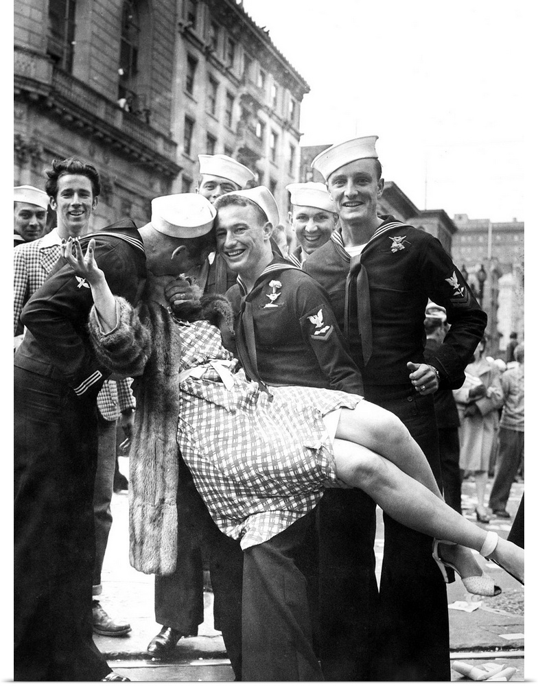 American sailors kissing and posing with a woman while celebrating the end of World War II, possibly in Times Square, New ...