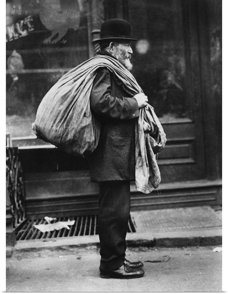An old man who buys old clothes in New York City. Photograph, c1910.