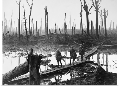 Australian troops walking along duckboards through the remains of Chateau Wood, 1917