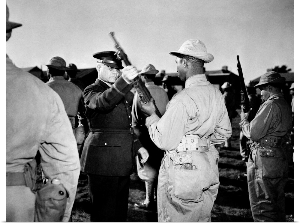 BENJAMIN O. DAVIS, SR. (1880-1970). U.S. Army officer. Brigadier General Davis inspecting an African American soldier's ri...