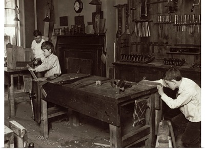 Boys learning carpentry in a woodwork shop class at the Henry St. Settlement, 1910