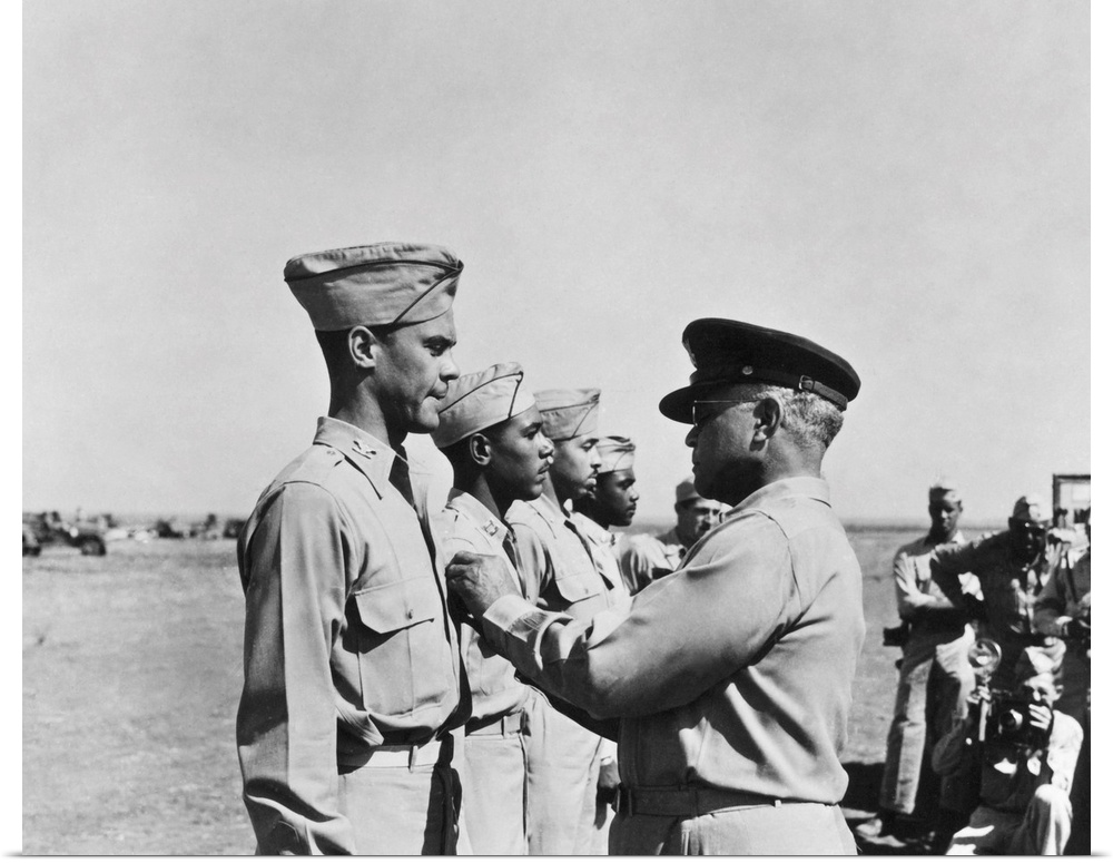 Brigadier General Benjamin Oliver Davis, Sr. pins the Distinguished Flying Cross on his son, Benjamin O. Davis, Jr., while...