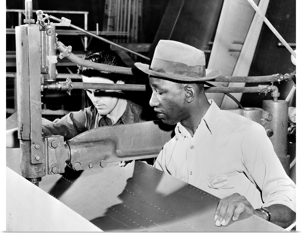 An African-American and Asian-American at work at the Douglas Aircraft factory in Los Angeles, California, during World Wa...