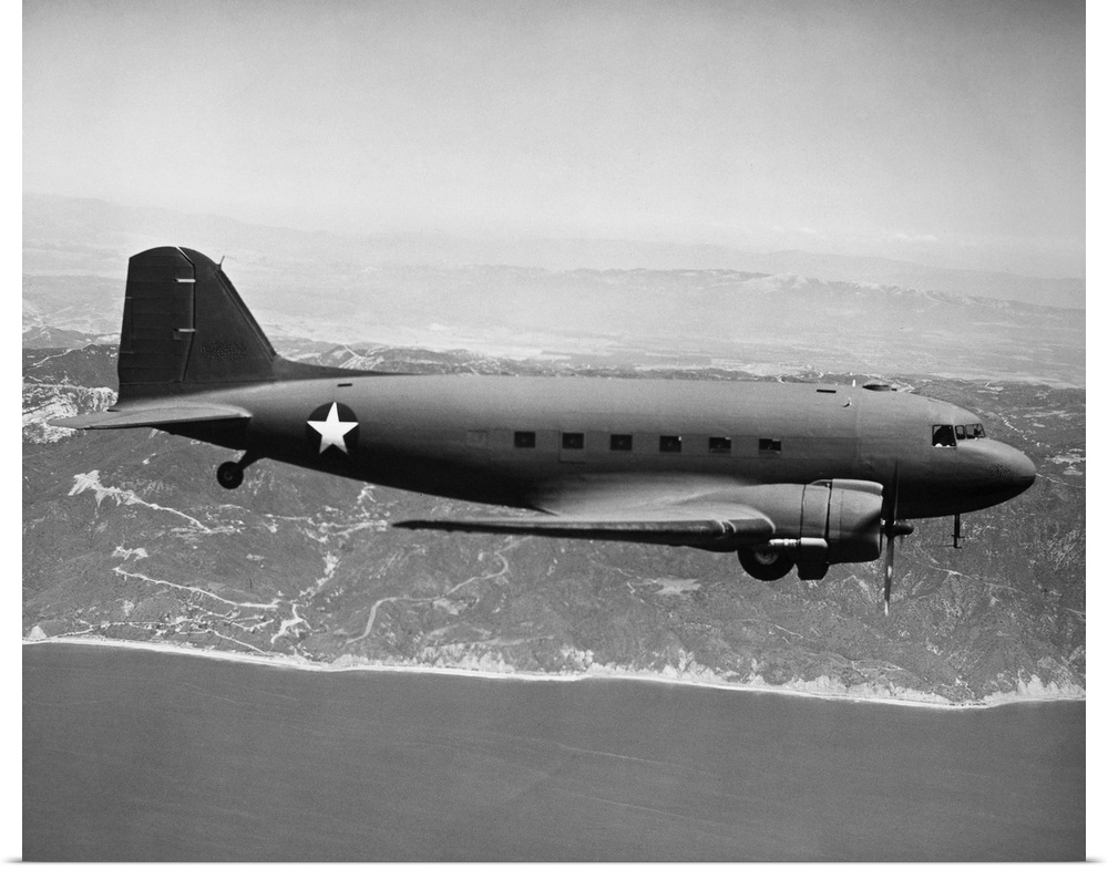 U.S. Air Force Douglas Skytrain C-47 (military cargo version of DC-3) in flight, location unknown, c1944, during World War...