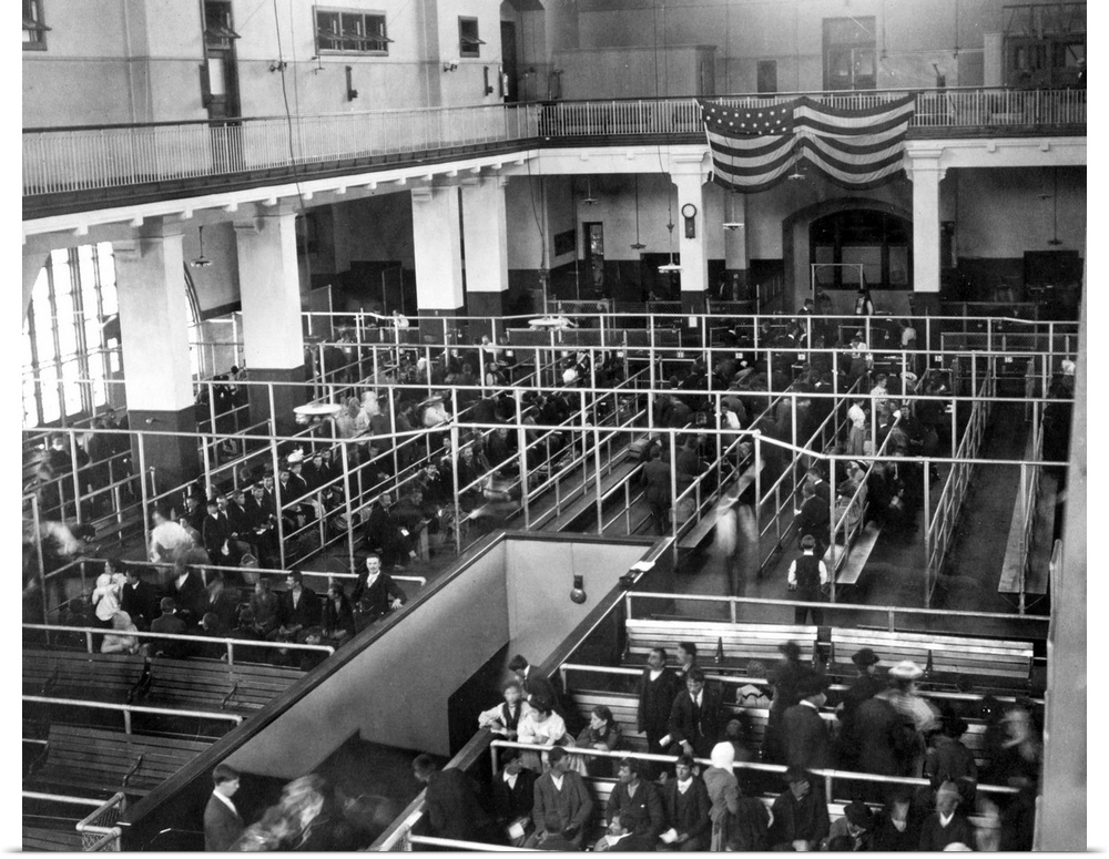 Immigrants waiting to be processed in the reception hall at Ellis Island, c1900.