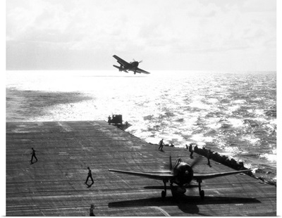 F6F Hellcats returning returning to a U.S. Navy aircraft carrier, 1943