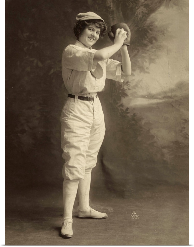 A female baseball player, in uniform, in a pitcher stance. Photograph, 1913.
