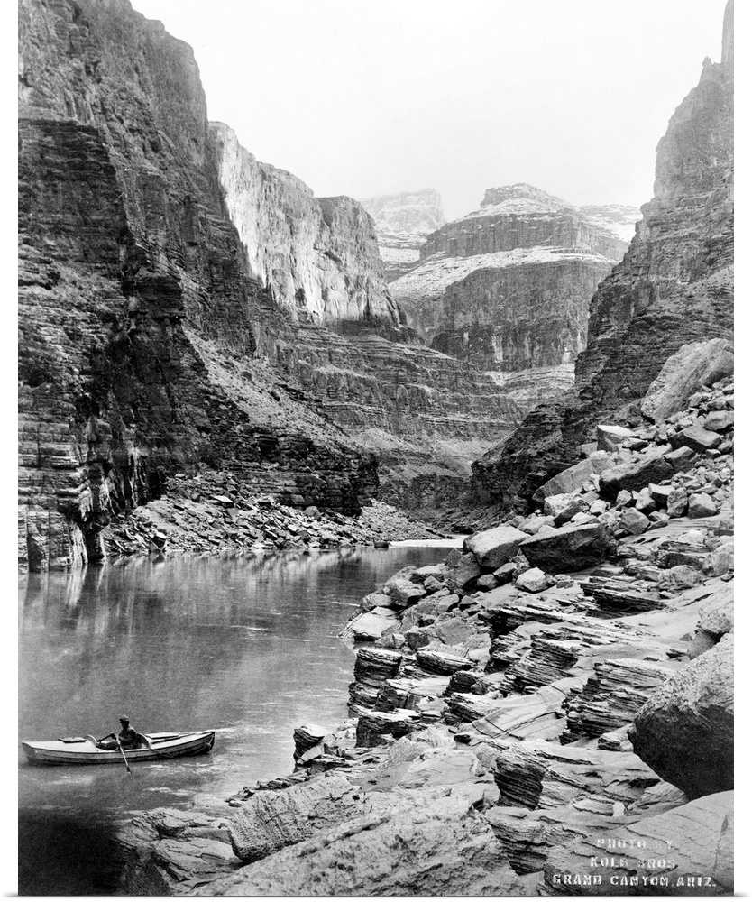 Grand Canyon, C1913. A View Of the Grand Canyon In Arizona, Showing A Man In A Boat On A River In the Foreground, And Snow...