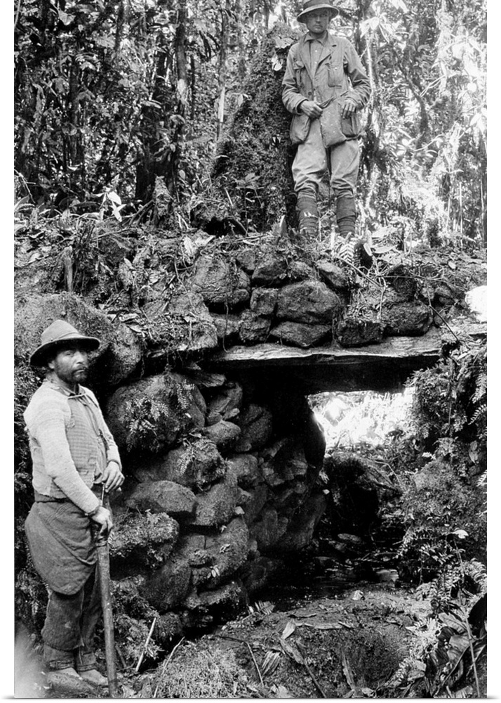 American explorer, teacher, and politician. Bingham (at top) resting on top of the Inca stone bridge at the ruins near Esp...