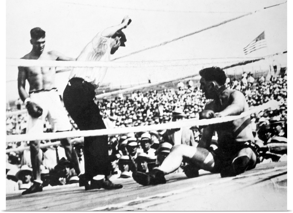 American boxer. Jack Dempsey (left) winning the heavyweight championship from Jess Willard on 4 July 1919 at Toledo, Ohio.