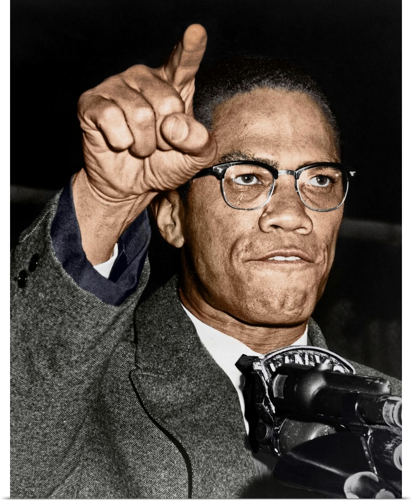 MALCOLM X (1925-1965). Born Malcolm Little. American religious and political leader. Photographed while giving a speech at...