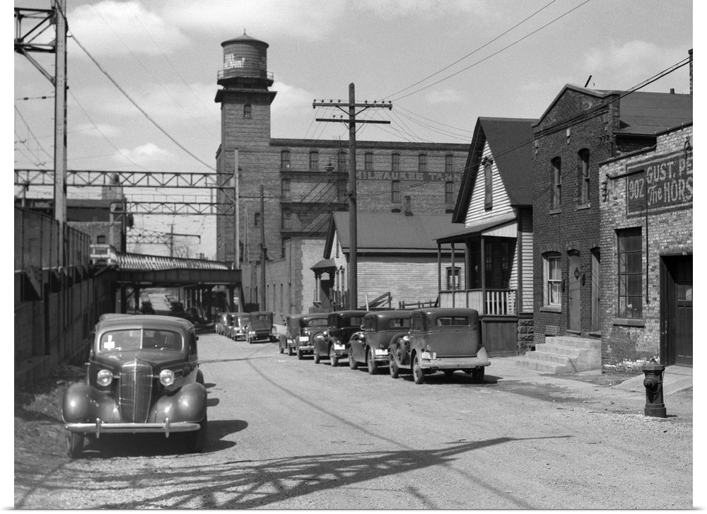 Working class houses on Detroit and Van Buren Streets, near the electric railroad, Milwaukee, Wisconsin. Photograph by Car...