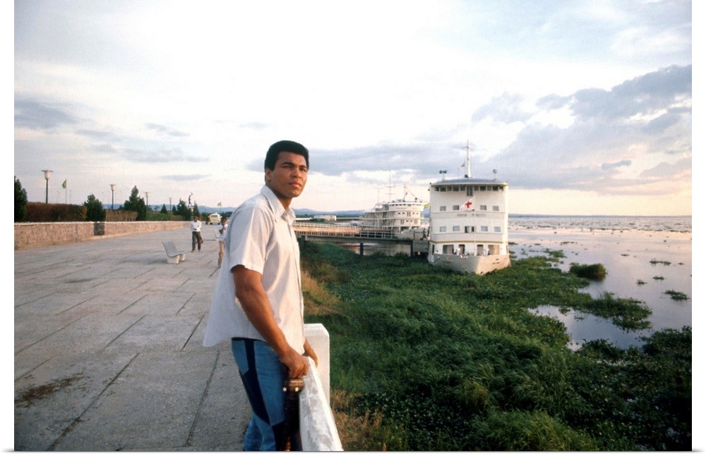 N? Cassius Clay. American heavyweight boxer. Photographed on the shore of the Congo River at Kinshasa, Zaire, September 19...