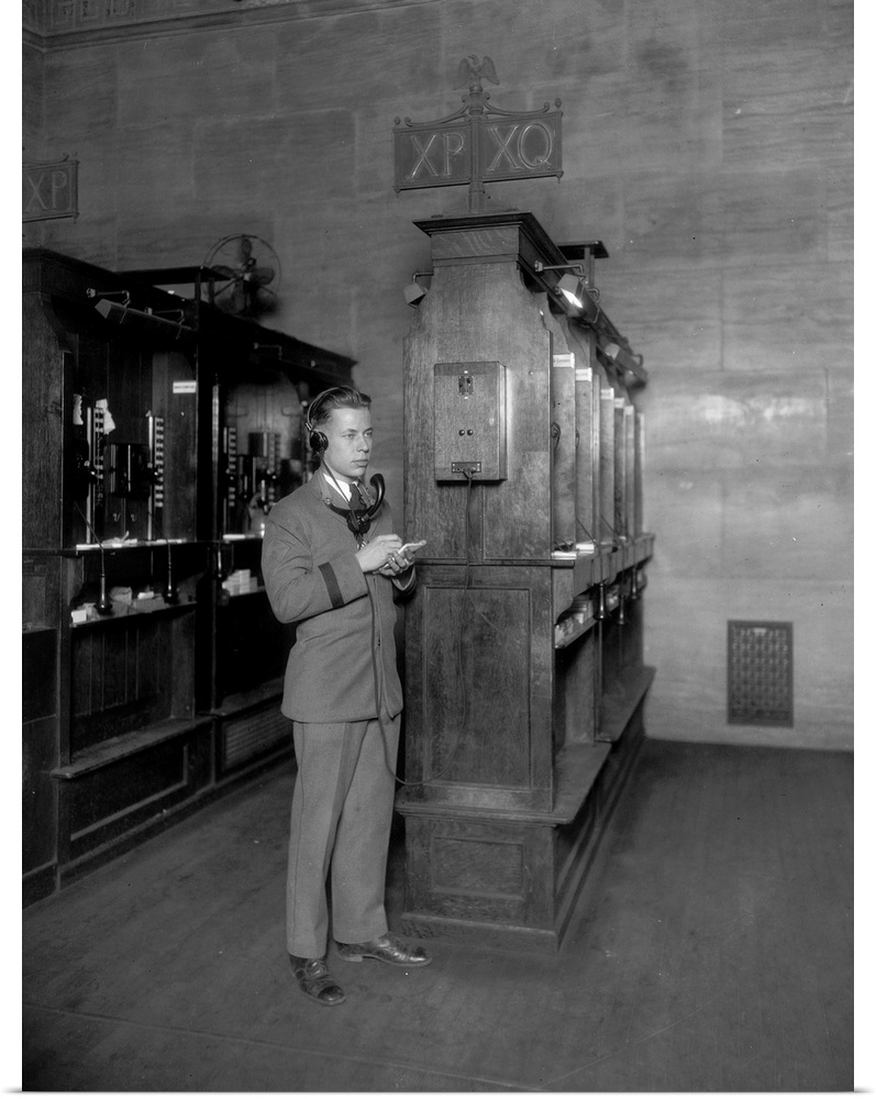 Telephone operator at booth of new quotation system. Photograph, c1928.