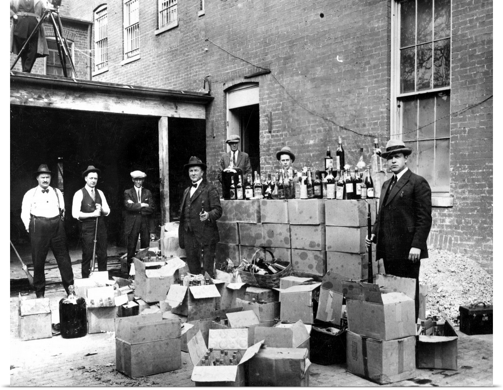 Revenue agents with confiscated bootleg liquor at Washington, D.C., Oct. 14, 1922.