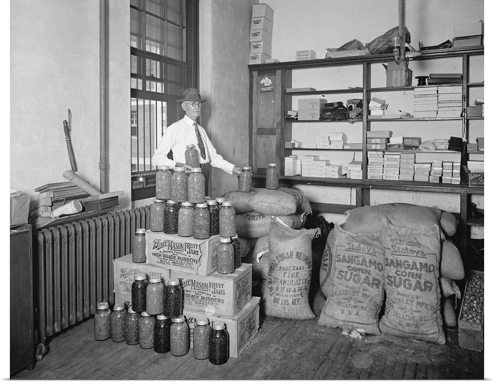 A man displaying the utilization of confiscated bootlegger paraphernalia during Prohibition in American, 1920s.