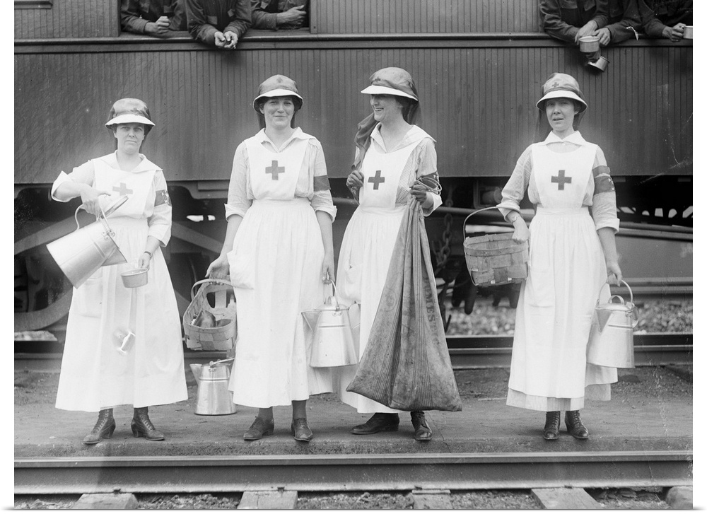 American Red Cross workers near train, c1918.